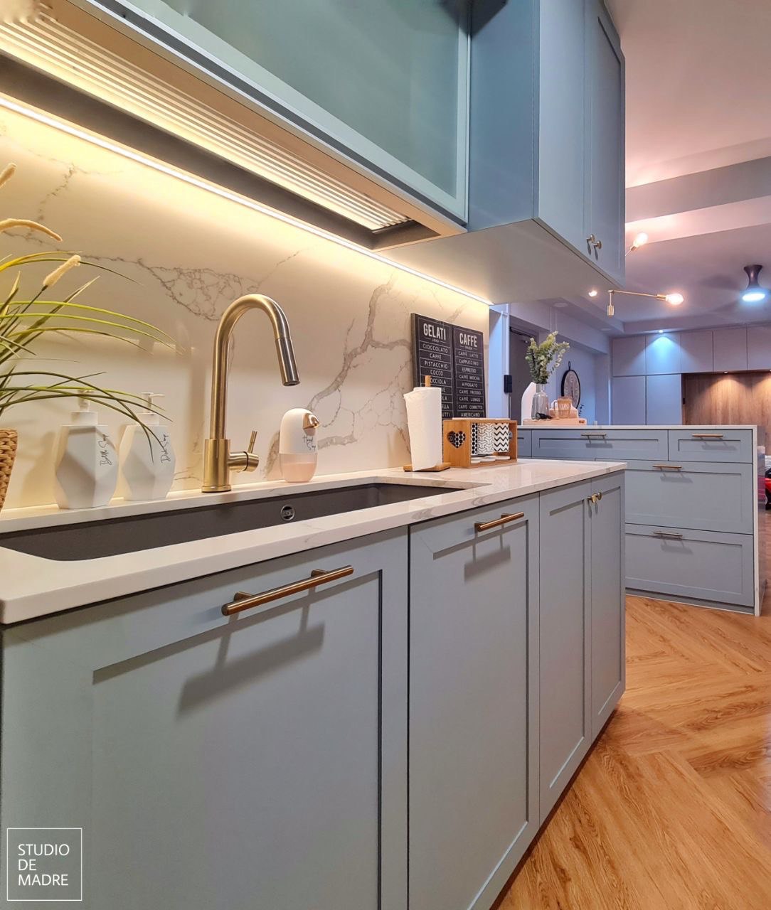 Modern kitchen with under-cabinet LED strip lighting by SDME Engineering