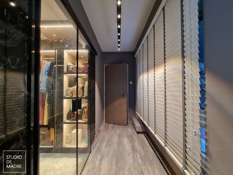 Walk-in wardrobe with precision track lighting and LED strips by SDME Engineering